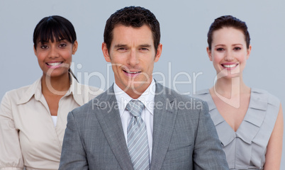 Smiling businessman leading his colleagues