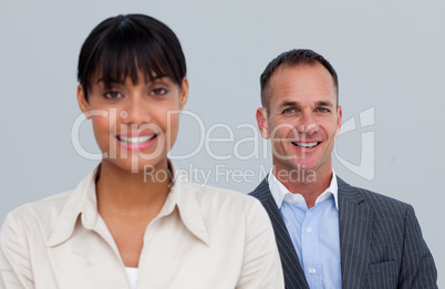 Smiling mature businessman behind his colleague