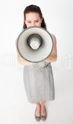 High angle of a businesswoman shouting through a megaphone