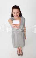 High angle of a businesswoman holding a white business card