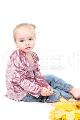 Toddler with maple leaves