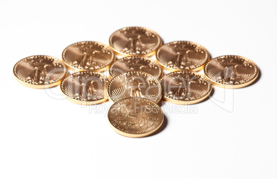 Diamond shaped gold coins on white