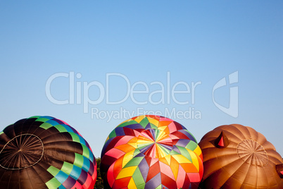 Three Hot air balloons being inflated