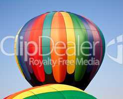 Multicolored Hot air balloon rising over another