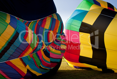 Two Hot air balloons being inflated