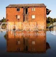 Reflection of red brick warehouse in Ellesmere Canal