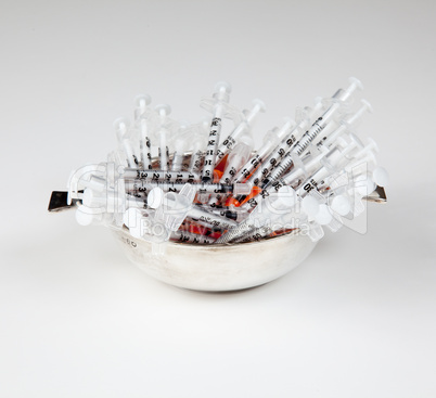 Close-up of used hypodermic syringes