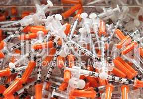 Close-up of used hypodermic syringes