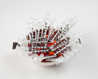 Close-up of used hypodermic syringes