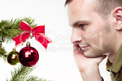 Man looking at Christmas toy