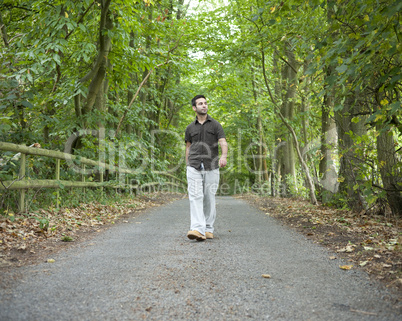 Man walking along a country lane