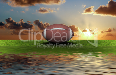 football on the green grass with sky background