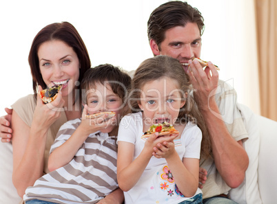 Happy family eating pizza
