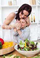 Mother and her little girl having fun in the kitchen