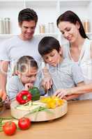 Happy parents and children cooking