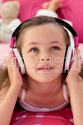Close-up of a cute girl listening musc
