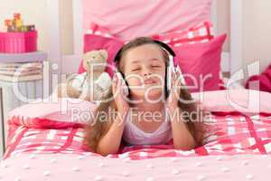Cute girl listening music with headphones