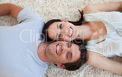 Smiling Couple lying on the floor