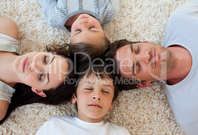 Family sleeping on the floor