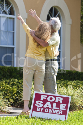 Senior Man and Woman Couple Viewing A House For Sale