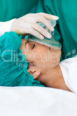 Female patient receiving anaesthetic