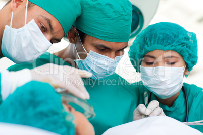 Serious surgeons during a surgery