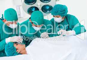 Surgeons near patient lying on an operating table