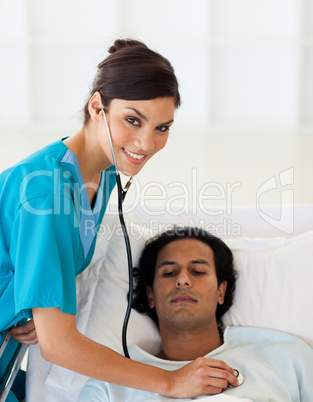 Female doctor checking the pulse of a patient