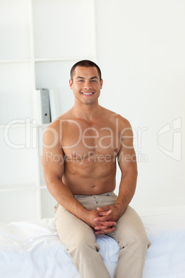 Smiling patient sitting on hospital bed
