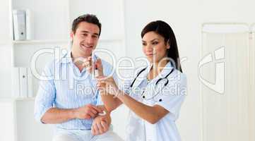 Female doctor preparing an injection