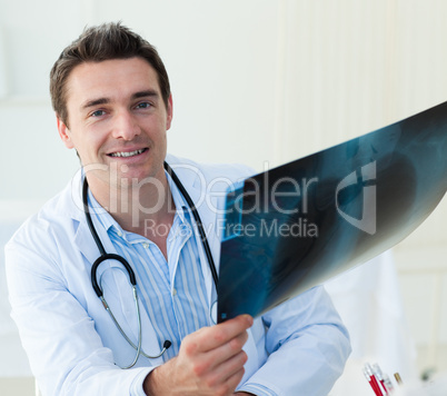 Attractive doctor examining an x-ray