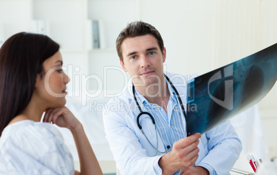 Confident doctors analyzing an x-ray