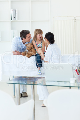 High angle of a doctor giving medecine to a little girl