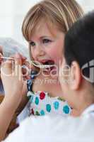 Close-up of a doctor giving medecine to a patient