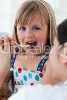 Close-up of a female doctor giving medecine to a child