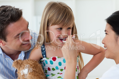 Smiling doctor giving medecine to a child