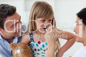 Smiling doctor giving medecine to a child