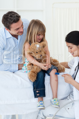 A doctor checking child's