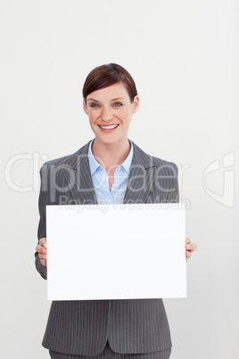 Confident businesswoman holding white card