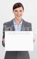 Smiling businesswoman holding white card