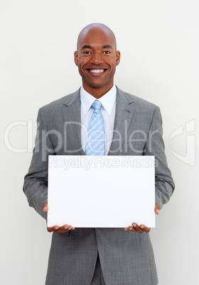 Smiling businessman holding white card
