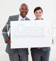 Smiling business people holding white card