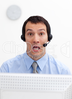 Laughing businessman with headset on