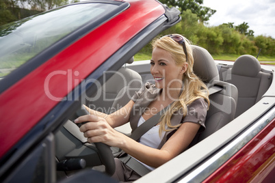 Beautiful Young Woman Driving Convertible Car