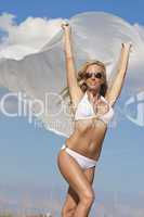 Beautiful Blond Woman Wearing Bikini On Beach With White Materia