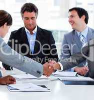 Close-up of successful business people closing a deal