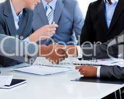 Close-up of business people greeting each other