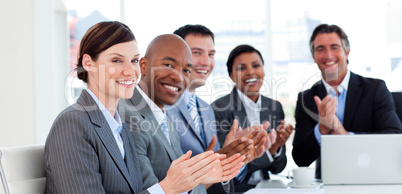 Portrait of an international business team clapping
