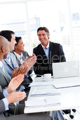 Team of successful business team applauding in a conference