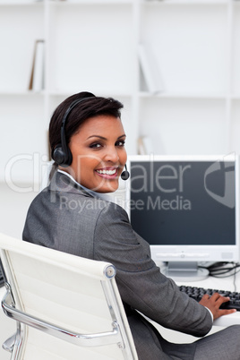 Ethnic businesswoman with headset on